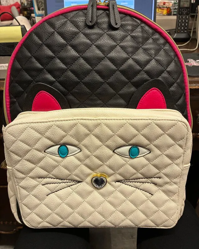 Betsey Johnson black and cream quilted backpack with a cat face