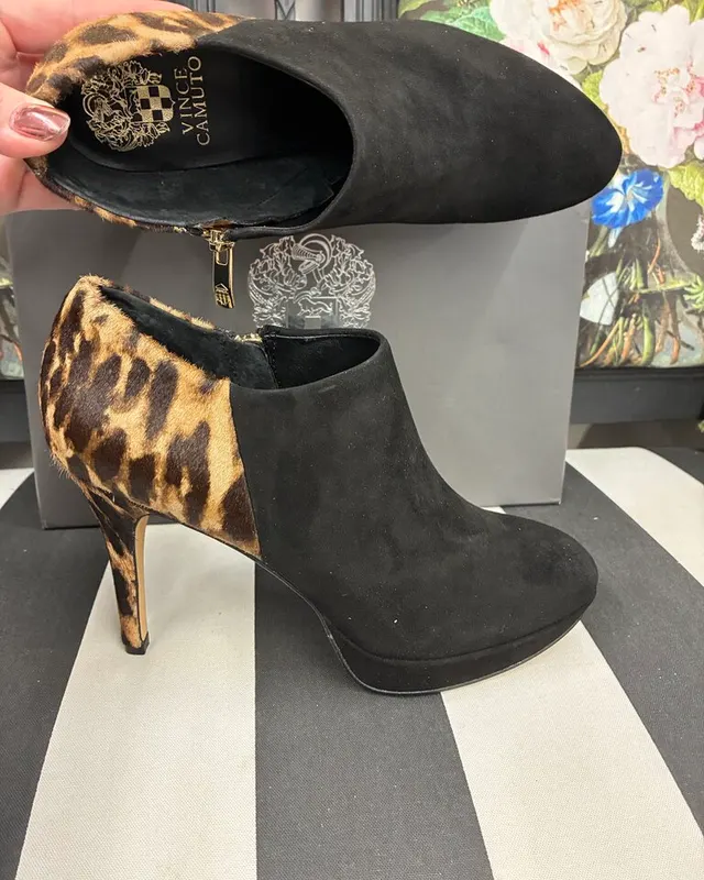 Black suede Vince Camuto heel booties with a leopard print fur heel